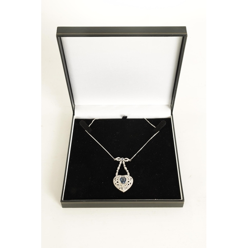 250 - A LADIES 18CT WHITE GOLD SAPPHIRE AND DIAMOND PENDANT on a 9ct white gold chain, the heart-shaped pe... 