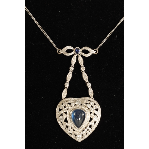 250 - A LADIES 18CT WHITE GOLD SAPPHIRE AND DIAMOND PENDANT on a 9ct white gold chain, the heart-shaped pe... 