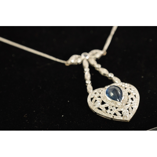 250 - A LADIES 18CT WHITE GOLD SAPPHIRE AND DIAMOND PENDANT on a 9ct white gold chain, the heart-shaped pe... 