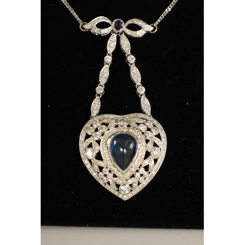 250 - A LADIES 18CT WHITE GOLD SAPPHIRE AND DIAMOND PENDANT on a 9ct white gold chain, the heart-shaped pe... 