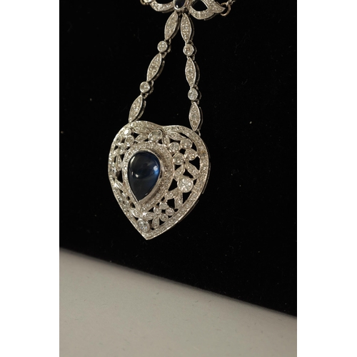 250 - A LADIES 18CT WHITE GOLD SAPPHIRE AND DIAMOND PENDANT on a 9ct white gold chain, the heart-shaped pe... 