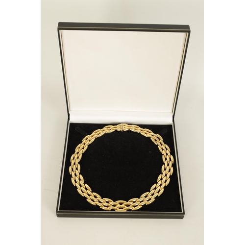 252 - CARTIER. A LADIES 18CT YELLOW GOLD GENTIANE CHOKER NECKLACE the three-row wide articulated choker ne... 