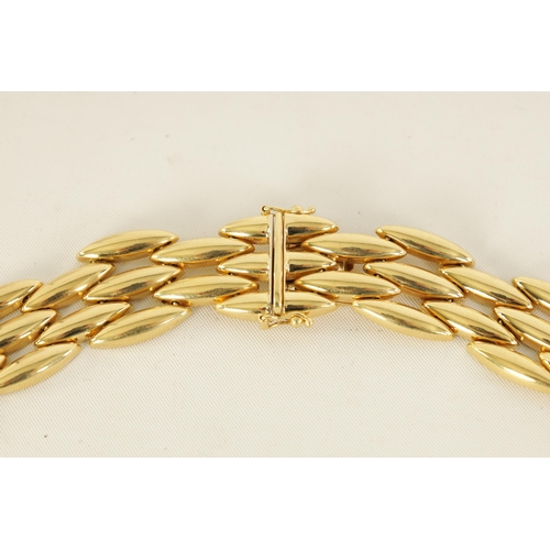 252 - CARTIER. A LADIES 18CT YELLOW GOLD GENTIANE CHOKER NECKLACE the three-row wide articulated choker ne... 