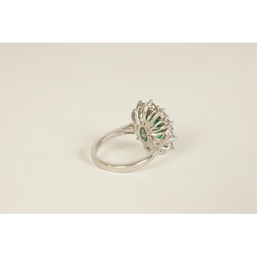 253 - A LARGE 18CT WHITE GOLD EMERALD AND DIAMOND RING set with a 3.31ct oval emerald surrounded by 11 bri... 