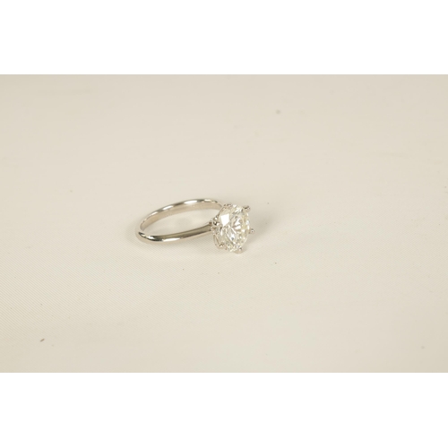 254 - A VERY FINE 18K WHITE GOLD 3CT SOLITAIRE DIAMOND RING the brilliant-cut stone (colour H-I, clarity V... 