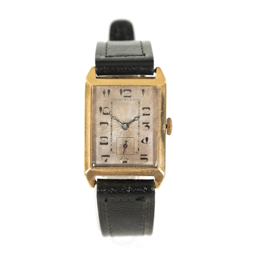 281 - A 1930's GENTLEMAN’S 9CT GOLD WRISTWATCH the rectangular case with bevelled edge enclosing an engine... 