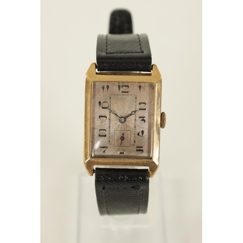 281 - A 1930's GENTLEMAN’S 9CT GOLD WRISTWATCH the rectangular case with bevelled edge enclosing an engine... 