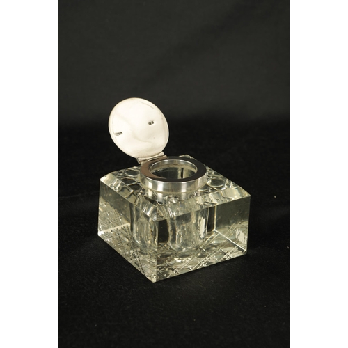 289 - AN EDWARD VII SQUARE HOBNAIL-CUT GLASS SILVER MOUNTED INKWELL the chamfer-edge top set with a silver... 