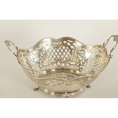 291 - A PAIR OF LATE VICTORIAN SILVER SWEET MEAT DISHES of oval form with scalloped edges and engraved cre... 