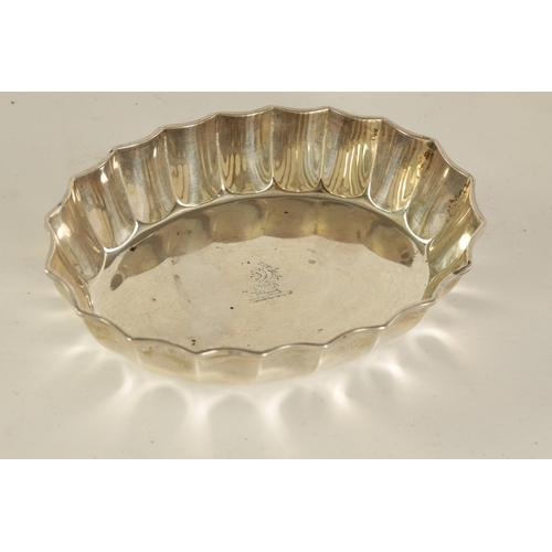 291 - A PAIR OF LATE VICTORIAN SILVER SWEET MEAT DISHES of oval form with scalloped edges and engraved cre... 