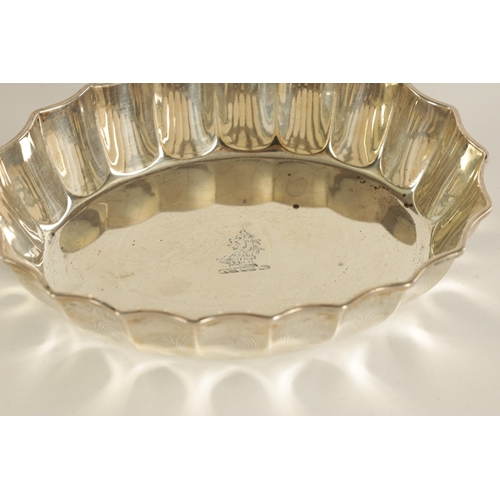 291 - A PAIR OF LATE VICTORIAN SILVER SWEET MEAT DISHES of oval form with scalloped edges and engraved cre... 