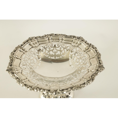 297 - A VICTORIAN SILVER PEDESTAL SWEETMEAT DISH the scalloped scrolled leafwork border enclosing a five s... 