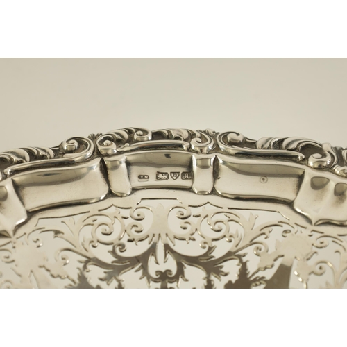 297 - A VICTORIAN SILVER PEDESTAL SWEETMEAT DISH the scalloped scrolled leafwork border enclosing a five s... 