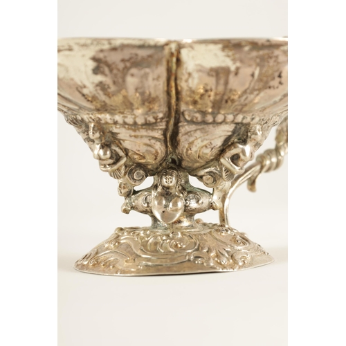 298 - A 19TH CENTURY CONTINENTAL SILVER BASKET cast with figures within joined shells mounted on a rococo ... 