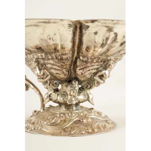 298 - A 19TH CENTURY CONTINENTAL SILVER BASKET cast with figures within joined shells mounted on a rococo ... 