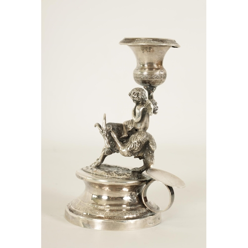 299 - A 19TH CENTURY CONTINENTAL SILVER FIGURAL CANDLESTICK modelled as Cupid riding a goat holding an eng... 