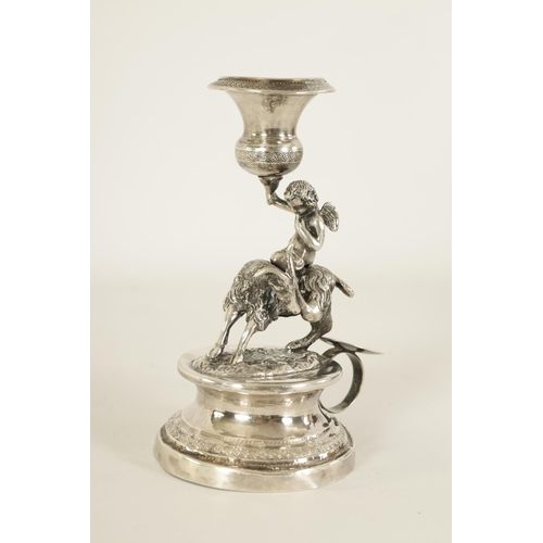 299 - A 19TH CENTURY CONTINENTAL SILVER FIGURAL CANDLESTICK modelled as Cupid riding a goat holding an eng... 