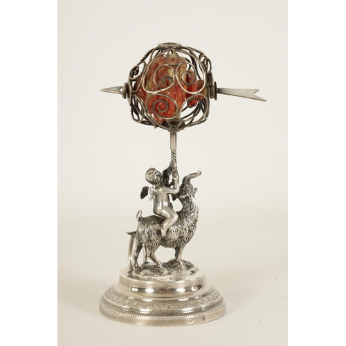 300 - A 19TH CENTURY CONTINENTAL SILVER FIGURAL WAX JACK modelled as Cupid riding a goat beneath a spheric... 