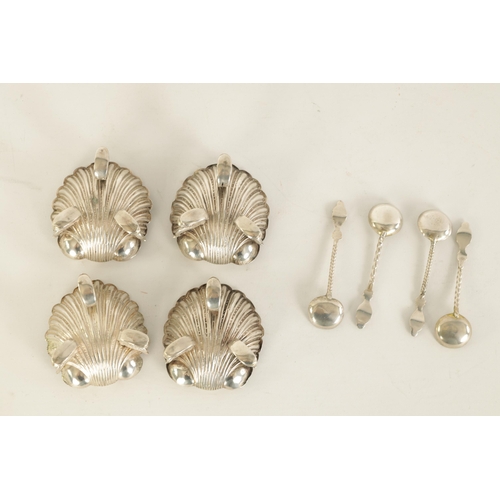 302 - A CASED SET OF FOUR VICTORIAN SILVER ROCOCO STYLE TABLE SALTS formed as shells with dolphin feet and... 