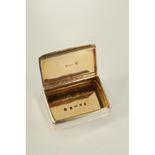 303 - A GEORGE III SCOTTISH SILVER SNUFF BOX of plain rectangular form with hinged inscribed lid and gilt ... 