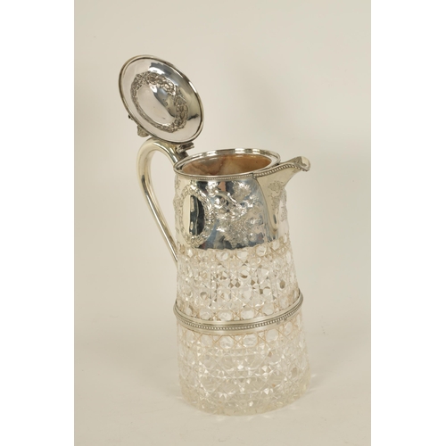 305 - A VICTORIAN SILVER MOUNTED CLARET JUG the tapering hobnail cut glass body and girdled silver neck mo... 