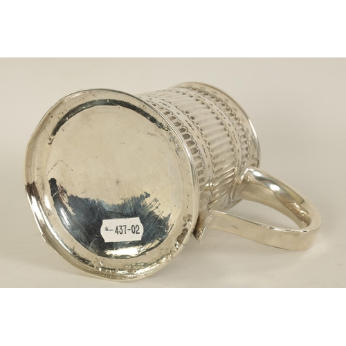 307 - AN EARLY GEORGIAN SILVER MUG the tapered body with fluted and punched decoration, shaped side handle... 