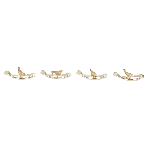 310 - A 20TH CENTURY CASED SET OF 12 SILVER AND SILVER GILT WISH BONE GAME BIRD NAPKIN HOLDERS comprising ... 