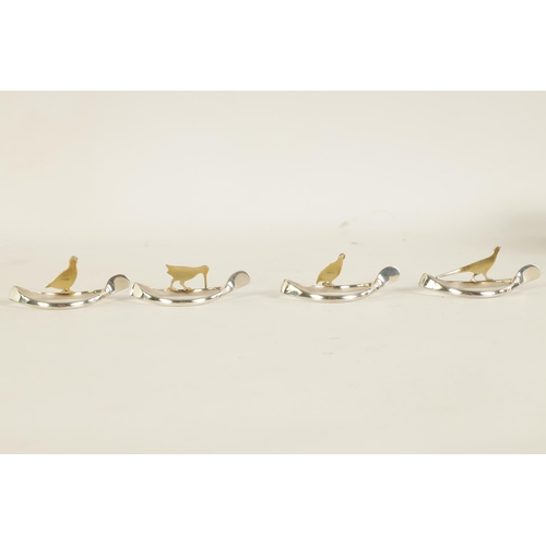 310 - A 20TH CENTURY CASED SET OF 12 SILVER AND SILVER GILT WISH BONE GAME BIRD NAPKIN HOLDERS comprising ... 