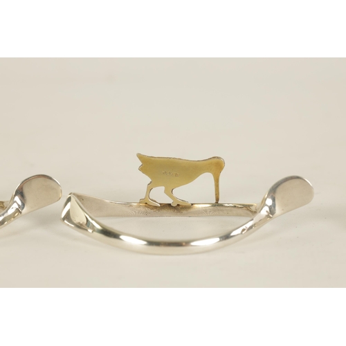 310 - A 20TH CENTURY CASED SET OF 12 SILVER AND SILVER GILT WISH BONE GAME BIRD NAPKIN HOLDERS comprising ... 