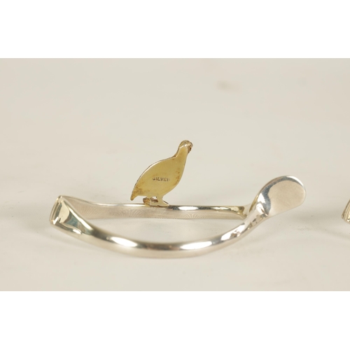 310 - A 20TH CENTURY CASED SET OF 12 SILVER AND SILVER GILT WISH BONE GAME BIRD NAPKIN HOLDERS comprising ... 