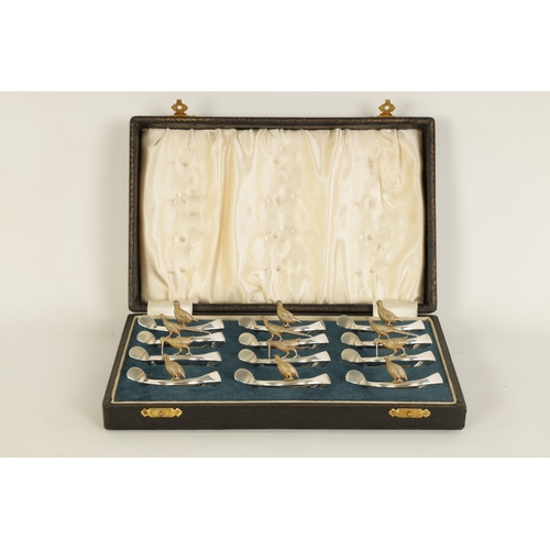 310 - A 20TH CENTURY CASED SET OF 12 SILVER AND SILVER GILT WISH BONE GAME BIRD NAPKIN HOLDERS comprising ... 