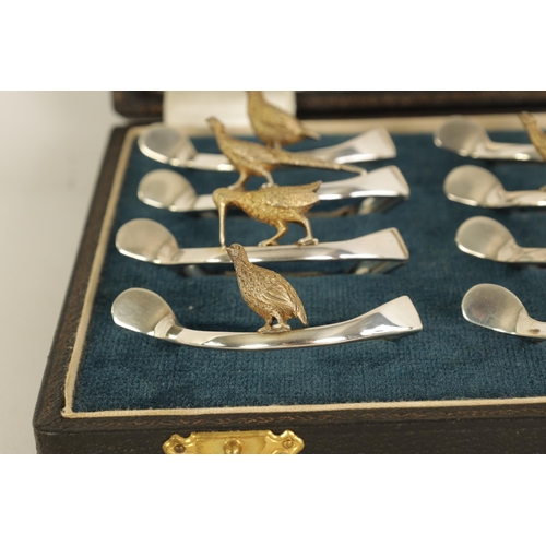 310 - A 20TH CENTURY CASED SET OF 12 SILVER AND SILVER GILT WISH BONE GAME BIRD NAPKIN HOLDERS comprising ... 