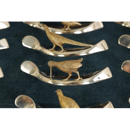 310 - A 20TH CENTURY CASED SET OF 12 SILVER AND SILVER GILT WISH BONE GAME BIRD NAPKIN HOLDERS comprising ... 