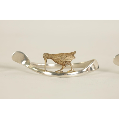 310 - A 20TH CENTURY CASED SET OF 12 SILVER AND SILVER GILT WISH BONE GAME BIRD NAPKIN HOLDERS comprising ... 