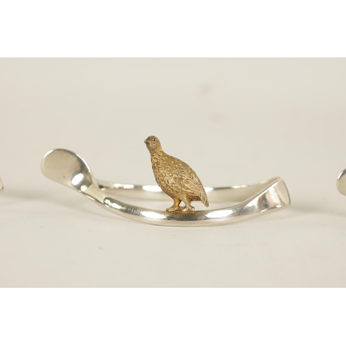 310 - A 20TH CENTURY CASED SET OF 12 SILVER AND SILVER GILT WISH BONE GAME BIRD NAPKIN HOLDERS comprising ... 