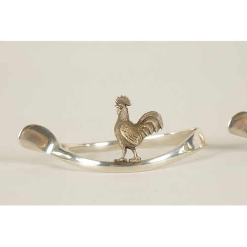 318 - OF COUNTRY SPORTS INTEREST - A SET OF FOUR EARLY 20TH CENTURY SILVER NAPKIN HOLDERS depiciting grame... 