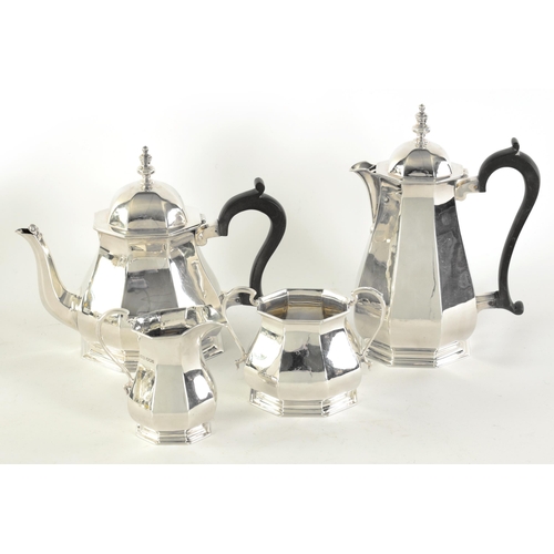 323 - A GEORGE VI FOUR PIECE SILVER TEA SERVICE of plain octagonal tapering baluster footed form, the teap... 