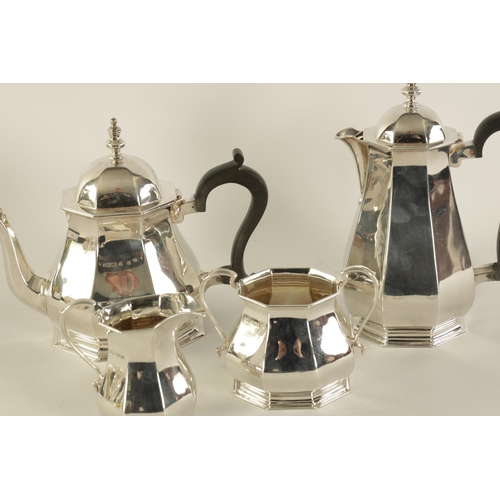 323 - A GEORGE VI FOUR PIECE SILVER TEA SERVICE of plain octagonal tapering baluster footed form, the teap... 