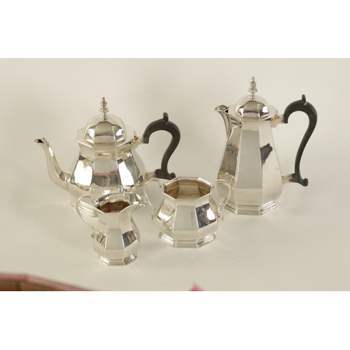 323 - A GEORGE VI FOUR PIECE SILVER TEA SERVICE of plain octagonal tapering baluster footed form, the teap... 