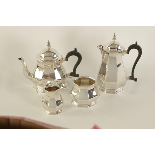 323 - A GEORGE VI FOUR PIECE SILVER TEA SERVICE of plain octagonal tapering baluster footed form, the teap... 