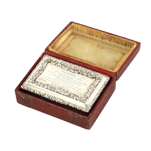 324 - A FINE EARLY VICTORIAN SILVER PRESENTATION SNUFF BOX of rectangular form with shaped and raised flow... 