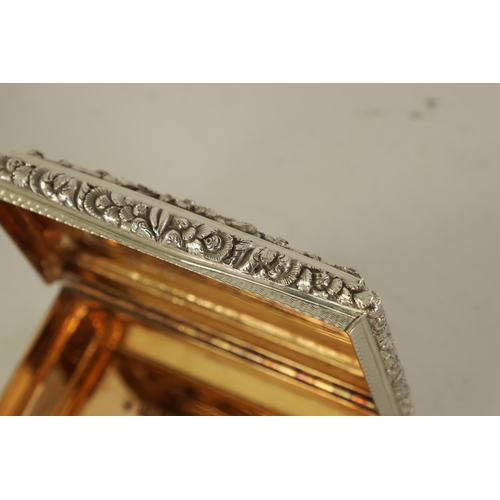 324 - A FINE EARLY VICTORIAN SILVER PRESENTATION SNUFF BOX of rectangular form with shaped and raised flow... 