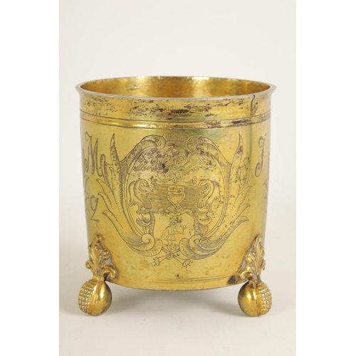 325 - A LATE 17TH CENTURY GERMAN SILVER GILT CYLINDRICAL BEAKER BEARING ENGRAVED FAMILY CRESTS AND INITIAL... 