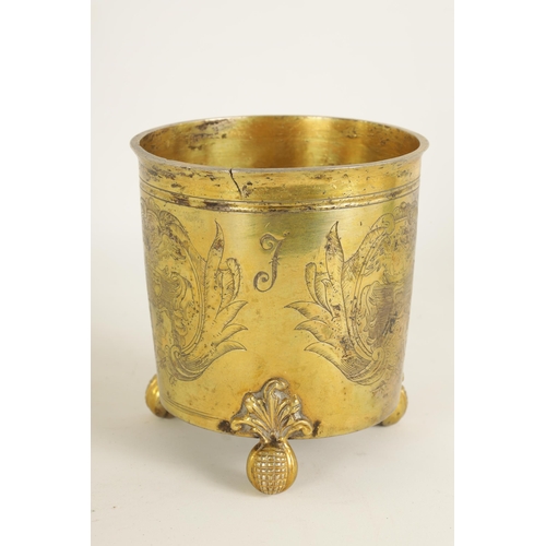 325 - A LATE 17TH CENTURY GERMAN SILVER GILT CYLINDRICAL BEAKER BEARING ENGRAVED FAMILY CRESTS AND INITIAL... 