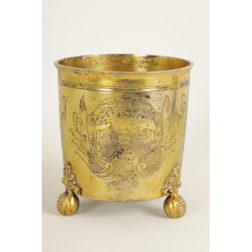 325 - A LATE 17TH CENTURY GERMAN SILVER GILT CYLINDRICAL BEAKER BEARING ENGRAVED FAMILY CRESTS AND INITIAL... 