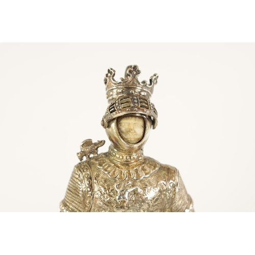 327 - A PAIR OF EARLY 20TH CENTURY GERMAN CAST SILVER SCULPTURES modelled as knights standing on floral pi... 