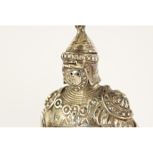 327 - A PAIR OF EARLY 20TH CENTURY GERMAN CAST SILVER SCULPTURES modelled as knights standing on floral pi... 