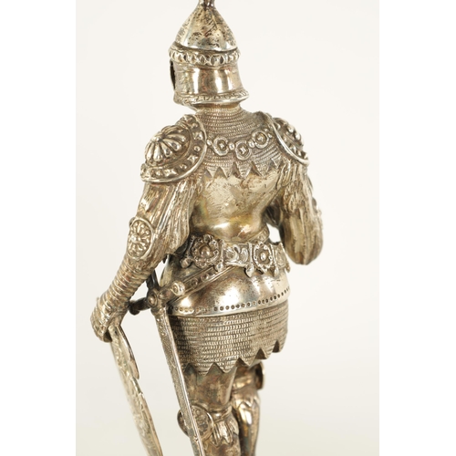 327 - A PAIR OF EARLY 20TH CENTURY GERMAN CAST SILVER SCULPTURES modelled as knights standing on floral pi... 