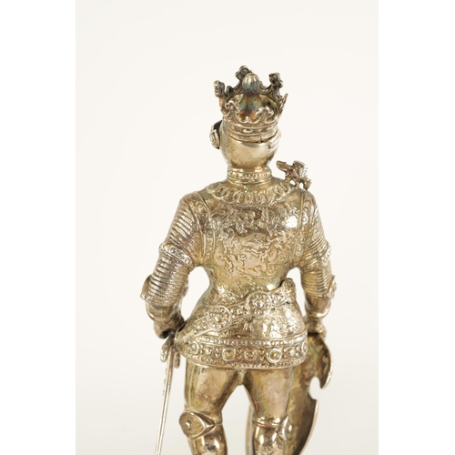 327 - A PAIR OF EARLY 20TH CENTURY GERMAN CAST SILVER SCULPTURES modelled as knights standing on floral pi... 