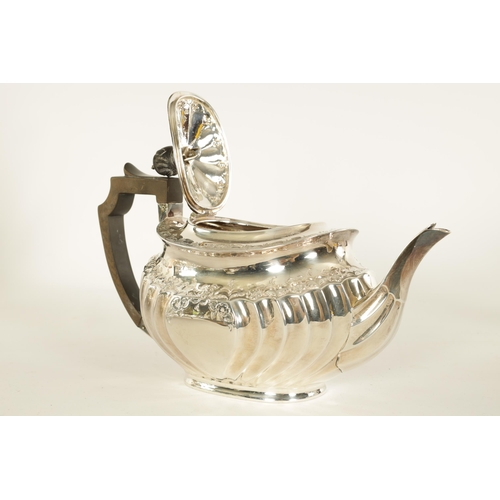 331 - AN EDWARD VII FIVE PIECE SILVER TEA SERVICE TOGETHER WITH A SILVER PLATED SALVER of oblate swirl-flu... 